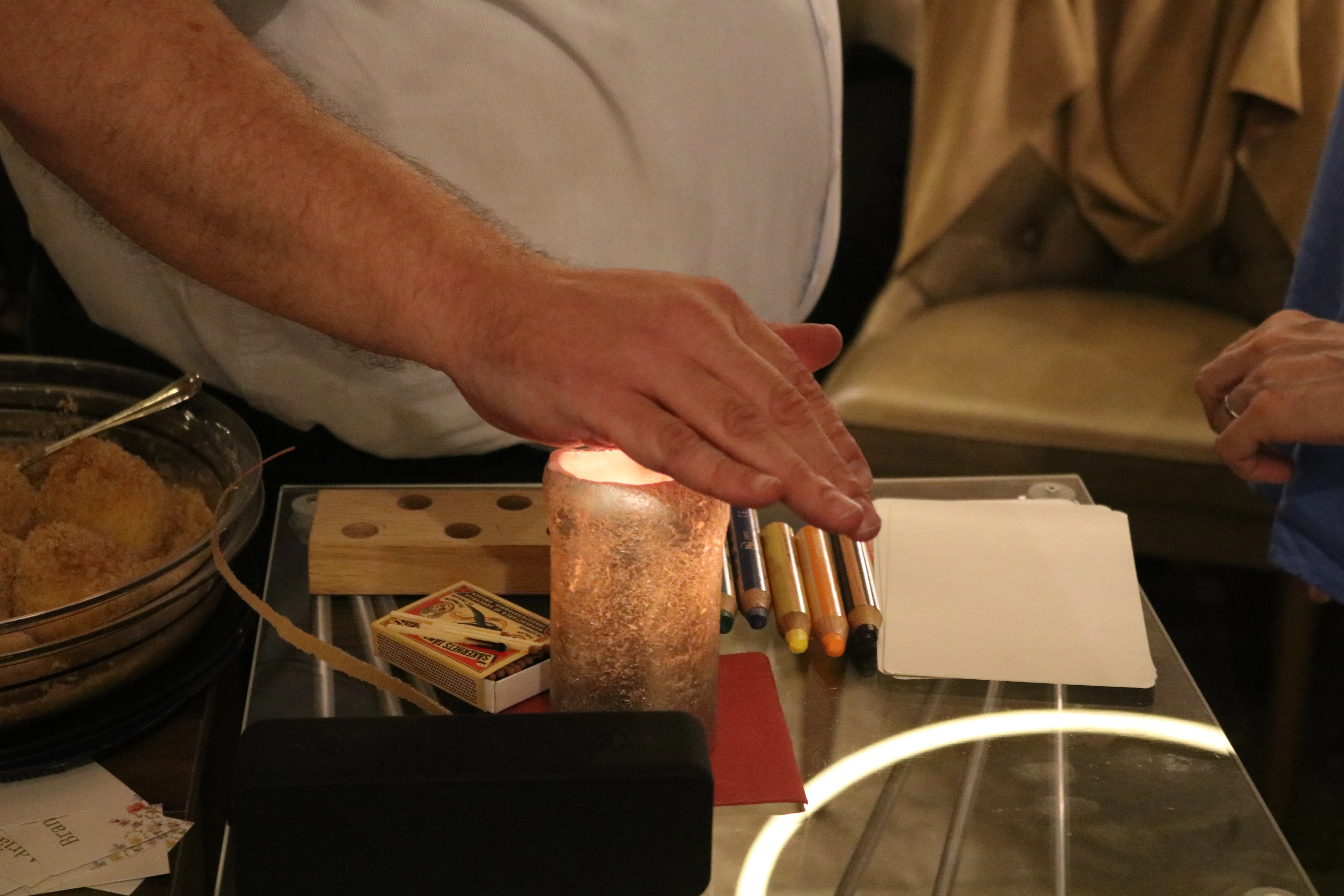Close-up: hands above cards